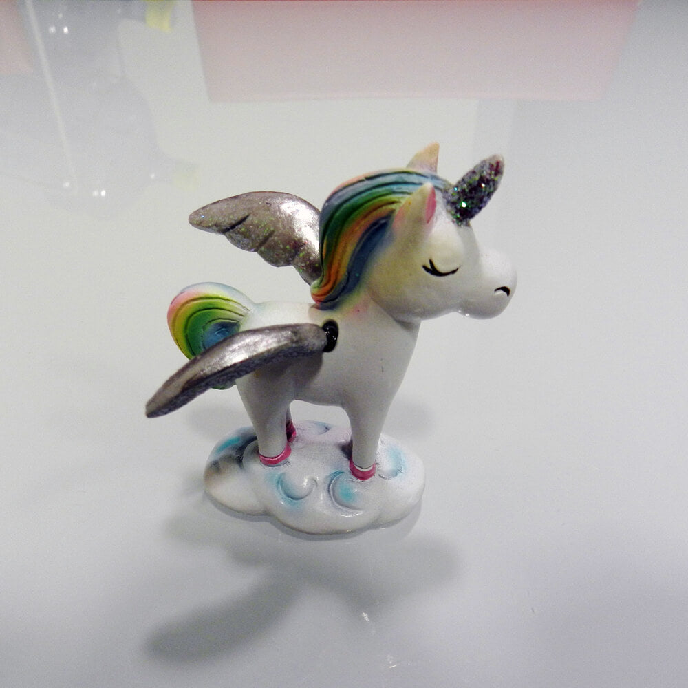 Figurita unicornio alas movimiento
